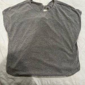 Grey top with short sleeves.